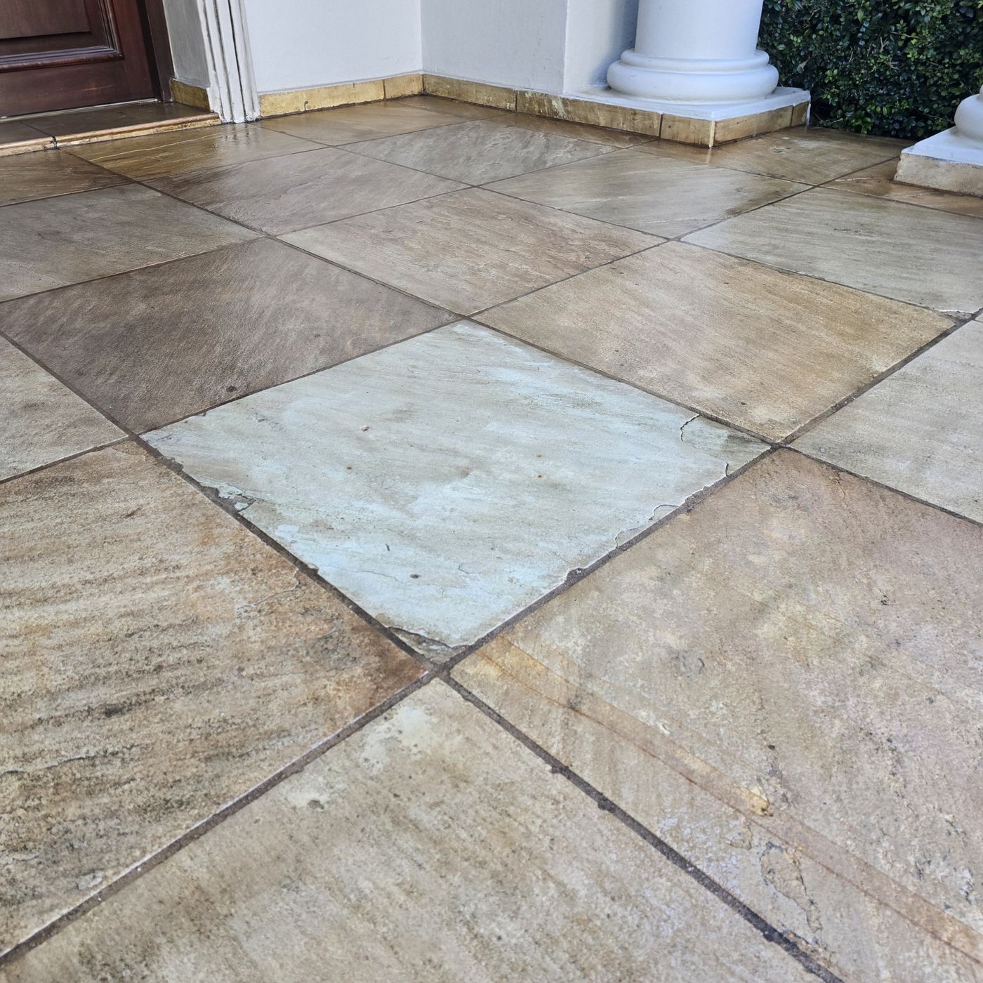 The same stone tiles after polyurethane coating, richer in colour